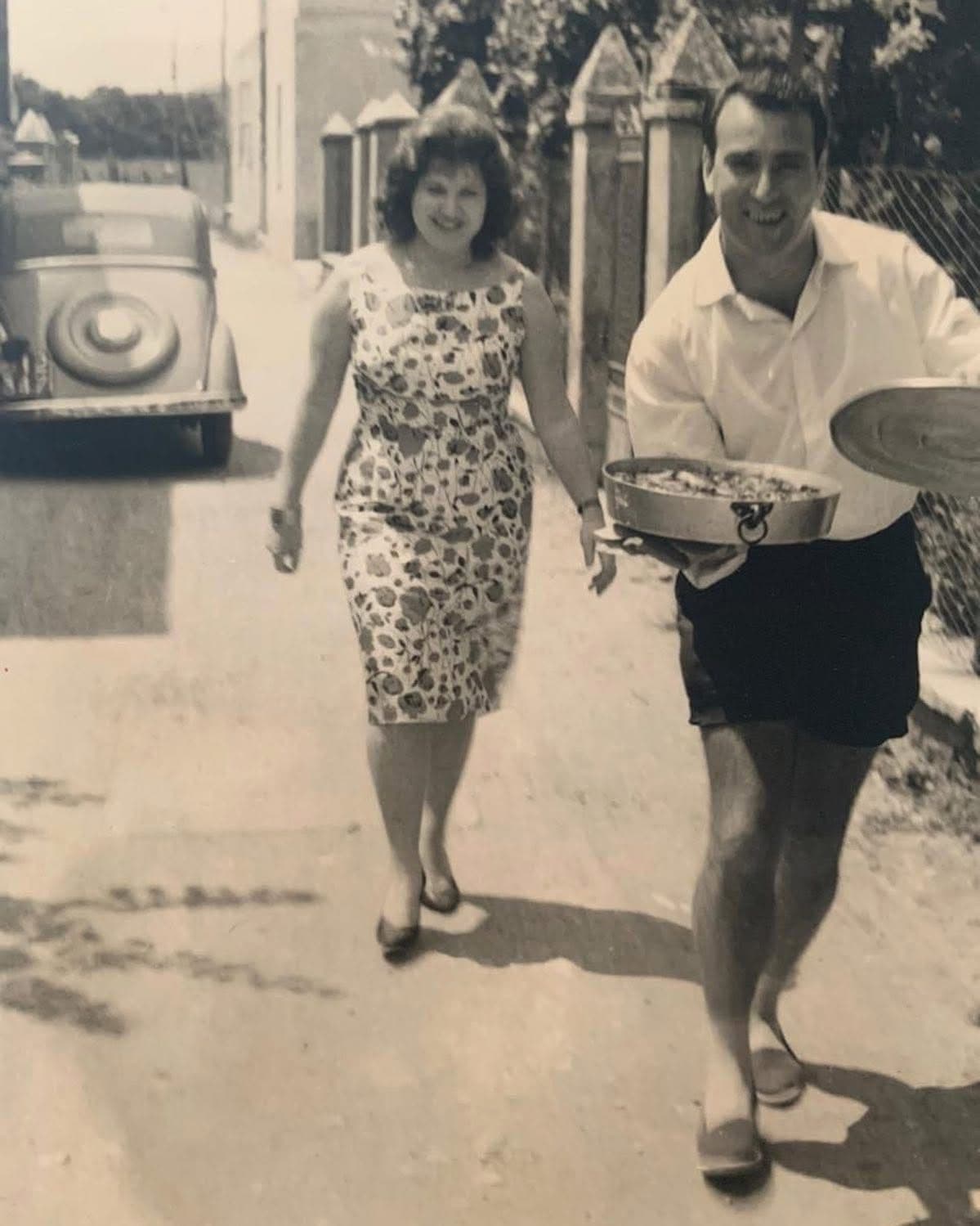 Vintage black and white photo of Nonno Raffaello and his wife walking together