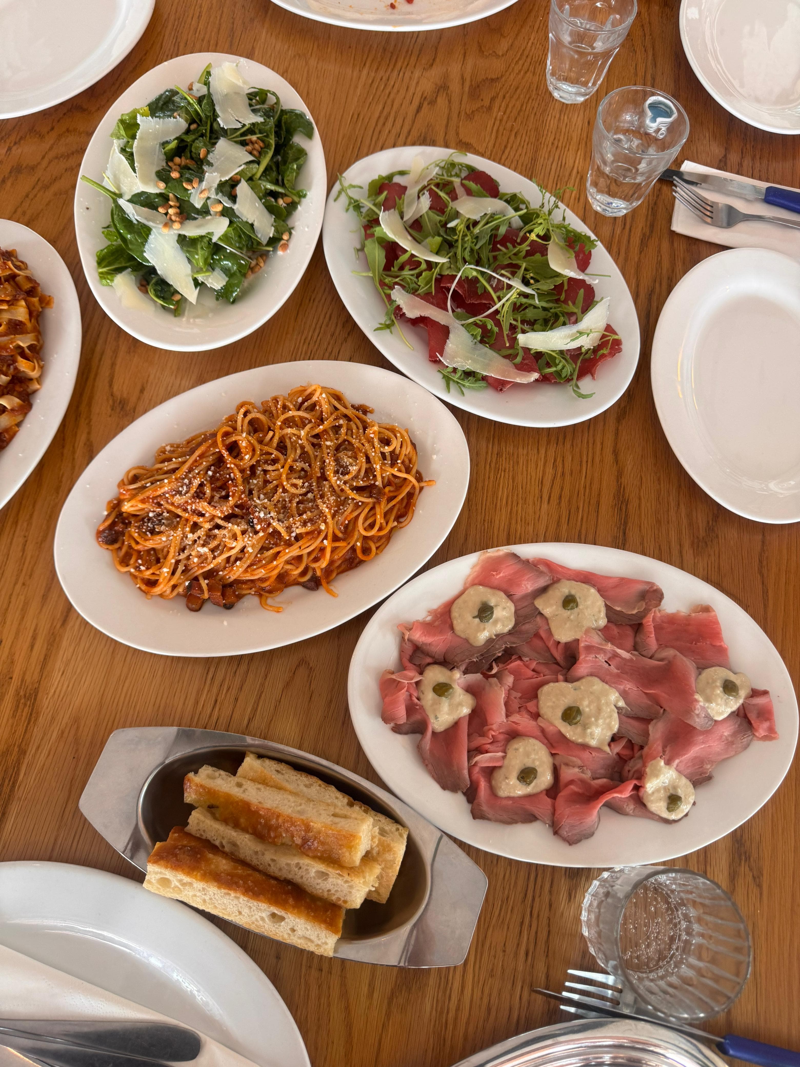 A hearty Italian feast of mains spread across the table family style