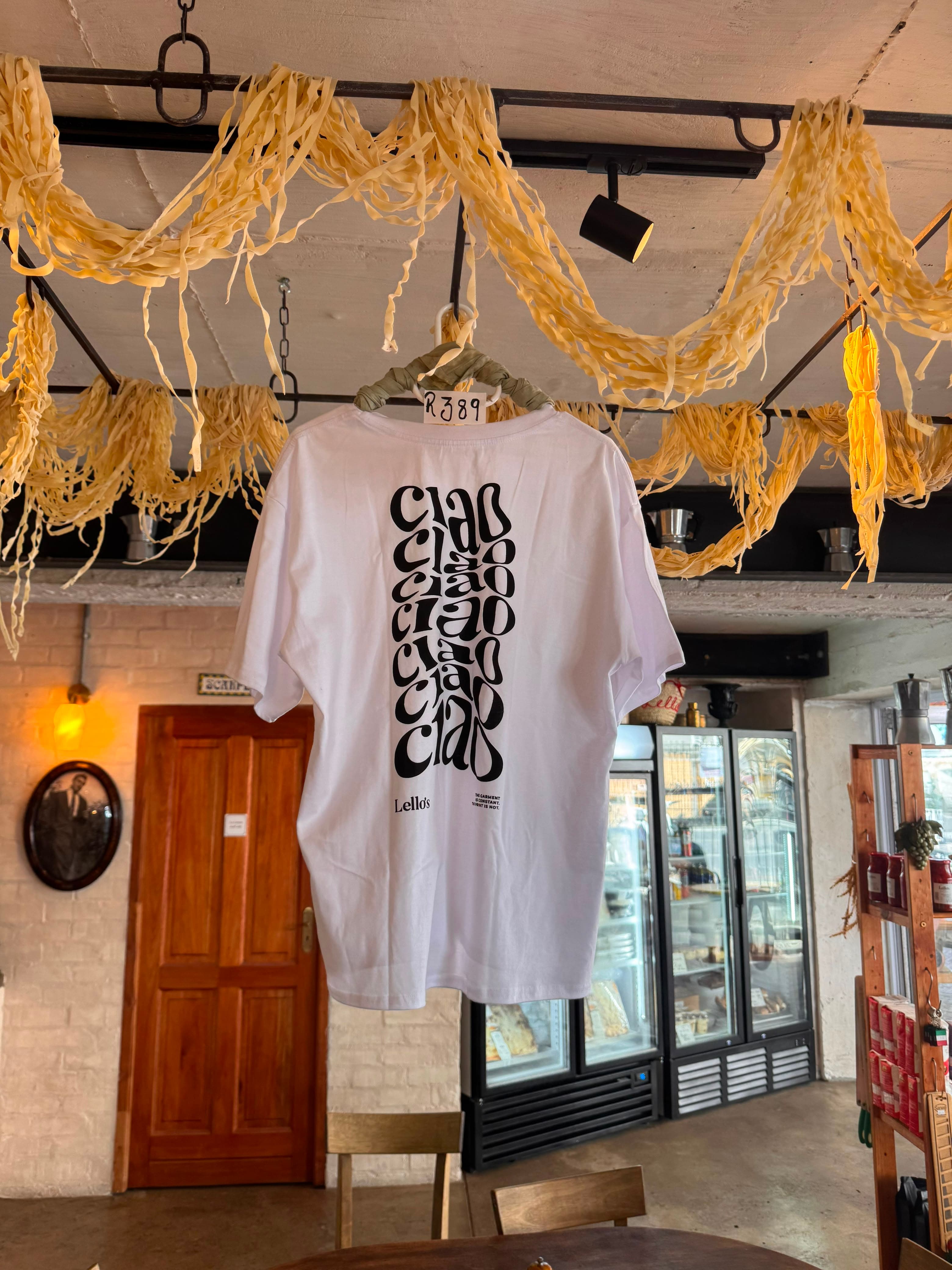 Lello's Ciao t-shirt hanging beneath fresh pasta drying from the ceiling