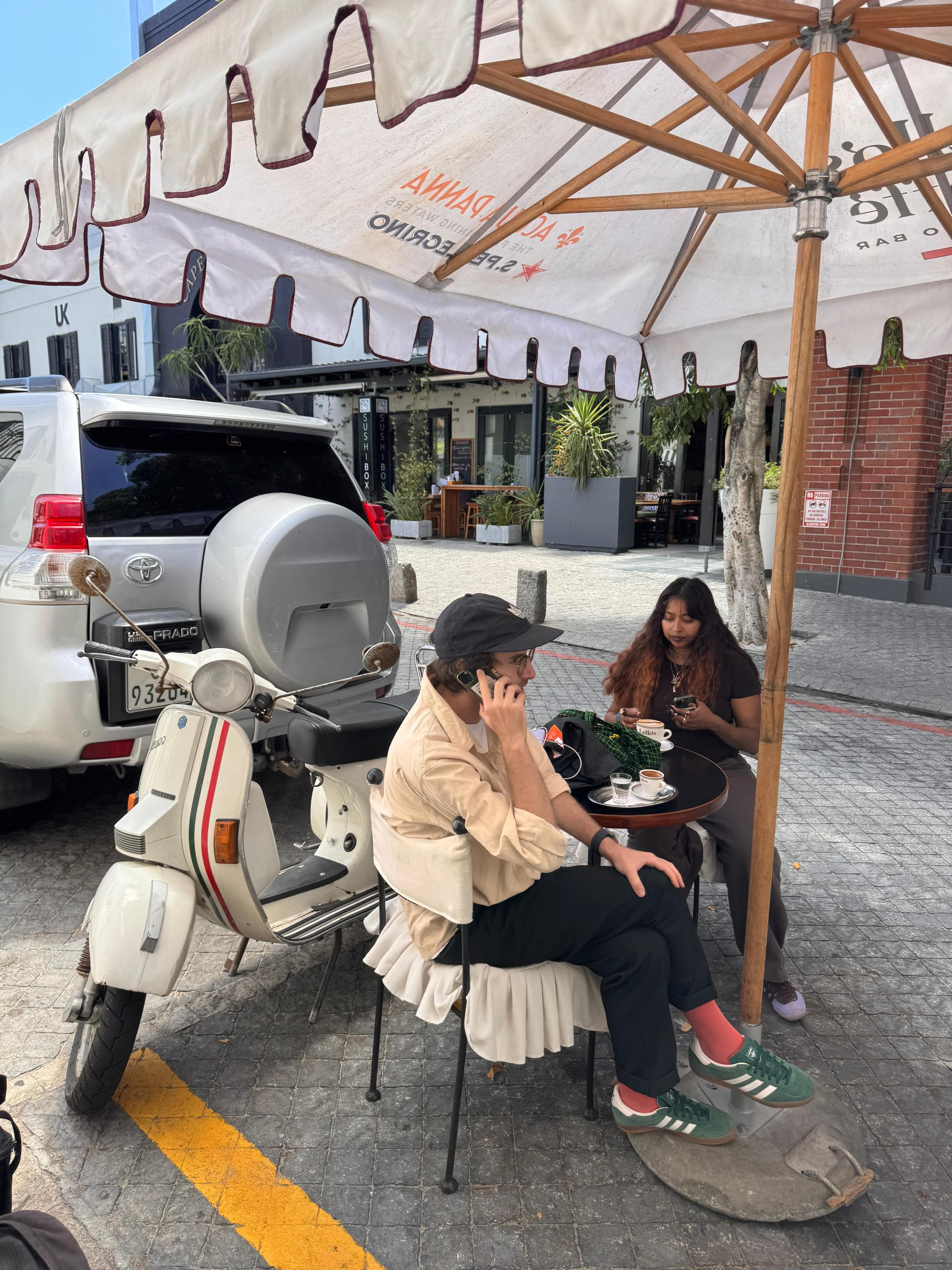 Guests enjoying coffee at Lello's Caffé outdoor seating area